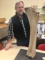 ray with mammoth leg bone 150 x 200.jpg