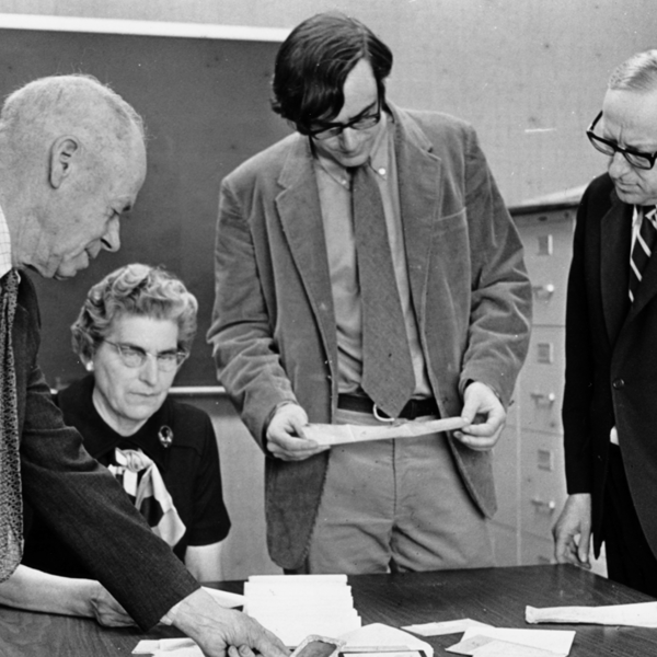 A group of students read copies of the Pointer newspaper