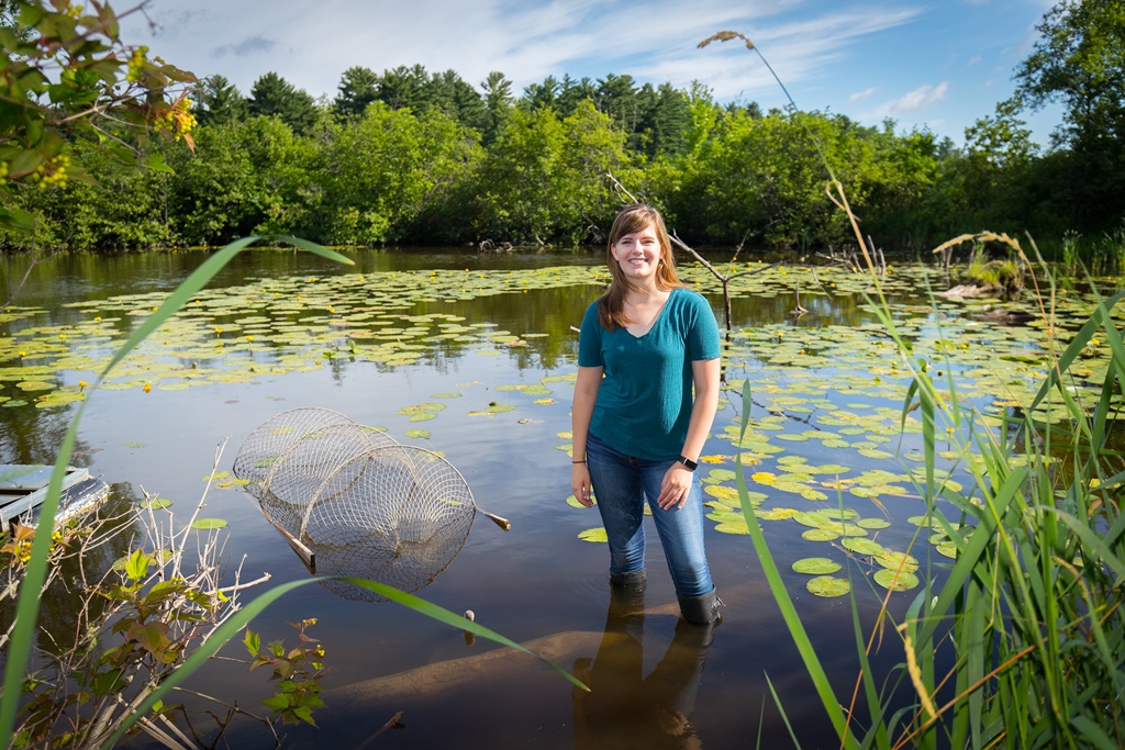 UW-Stevens Point biology major Mara Hathaway checks a turtle trap